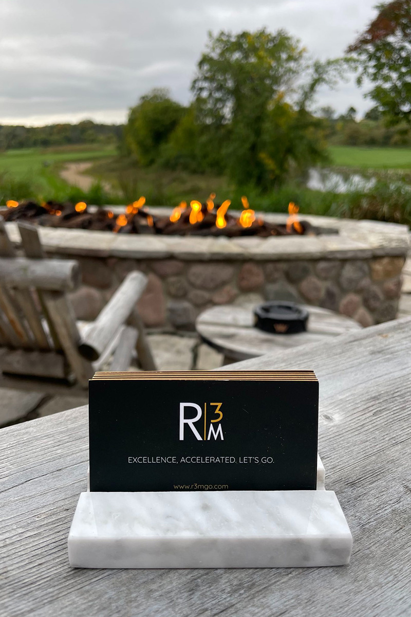 R3M plaque in front of an outdoor fireplace