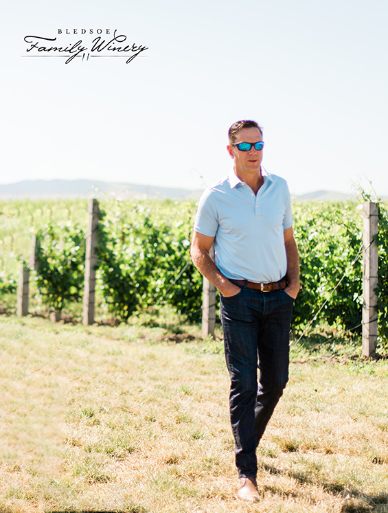 Drew Bledsoe walking away from the vineyard